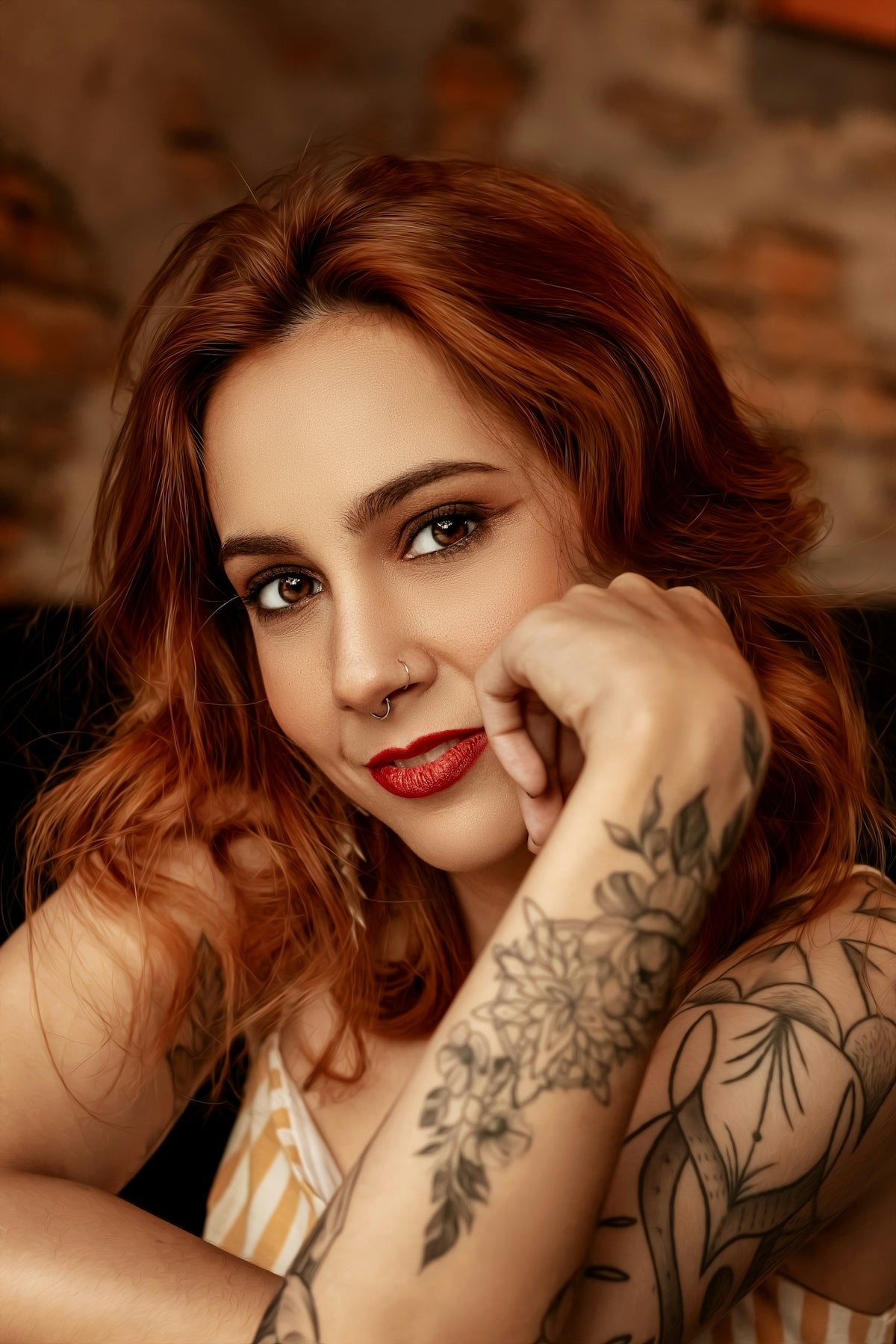 a woman with red hair and tattoos posing for a picture