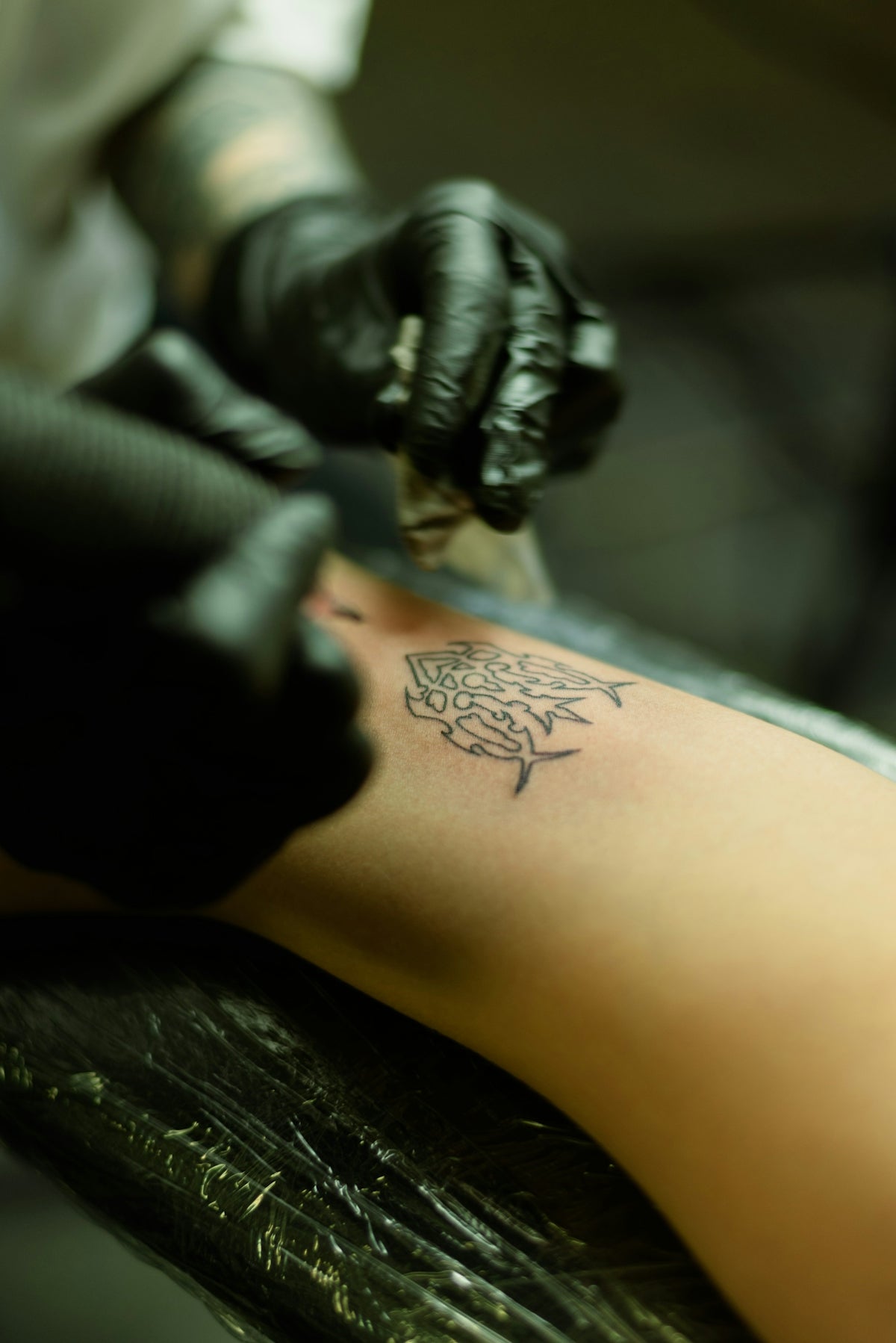 a person with a tattoo on their arm