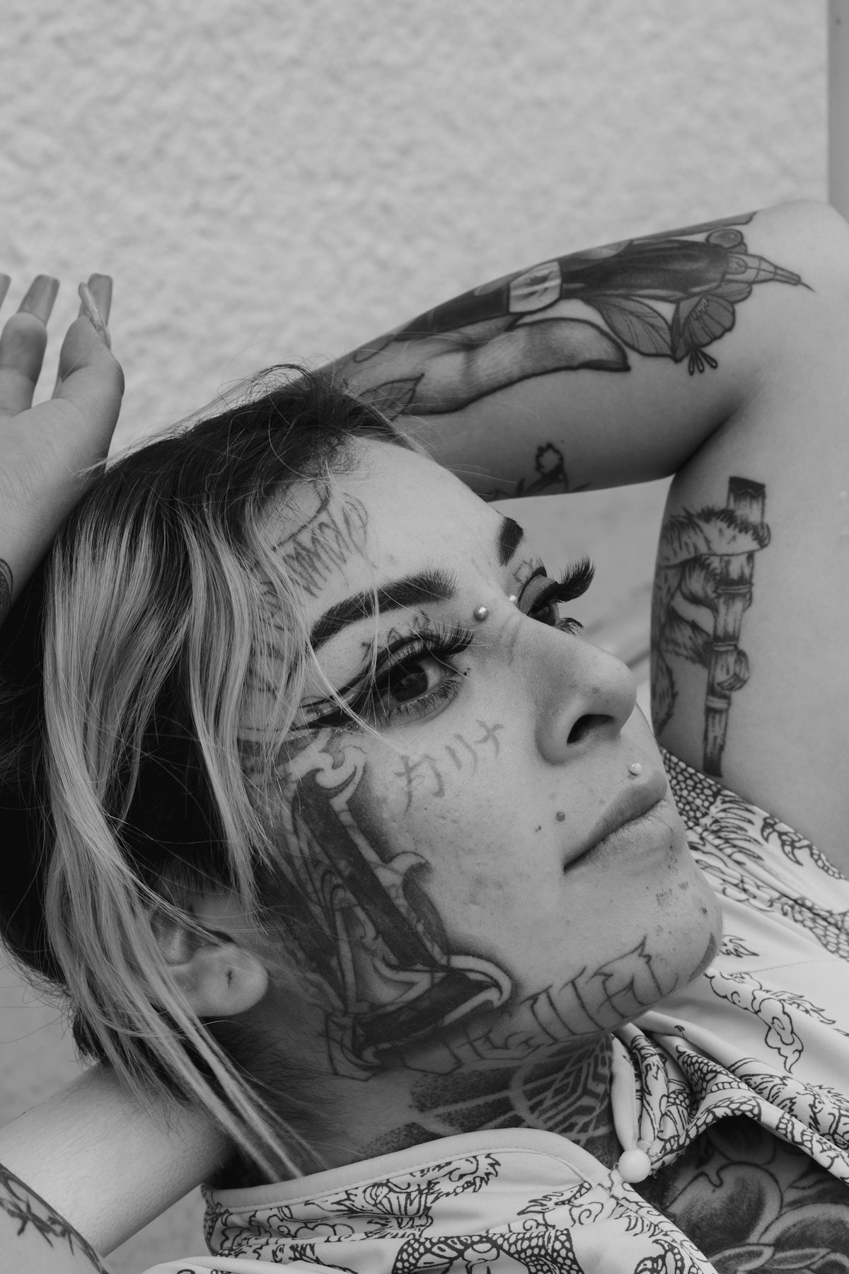 a person with a tattoo on the arm