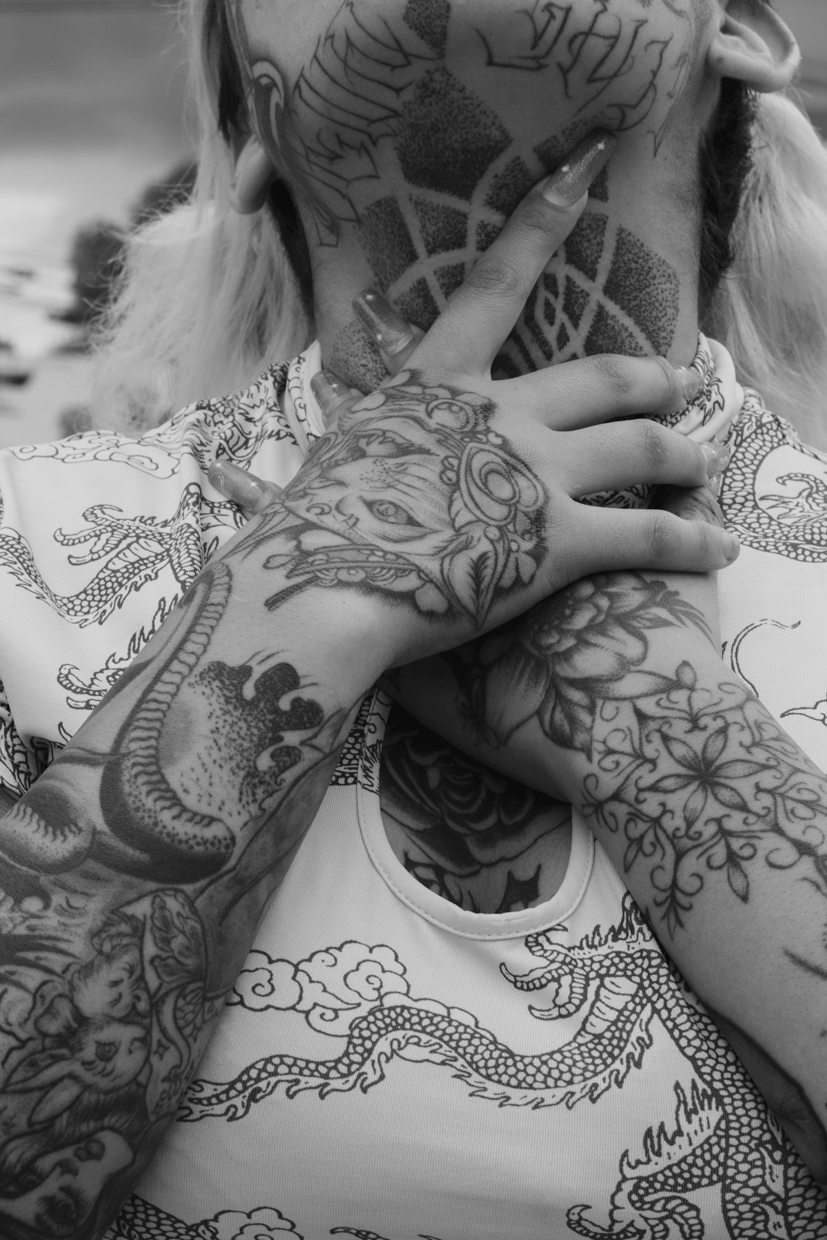 a person with tattoos on the arm