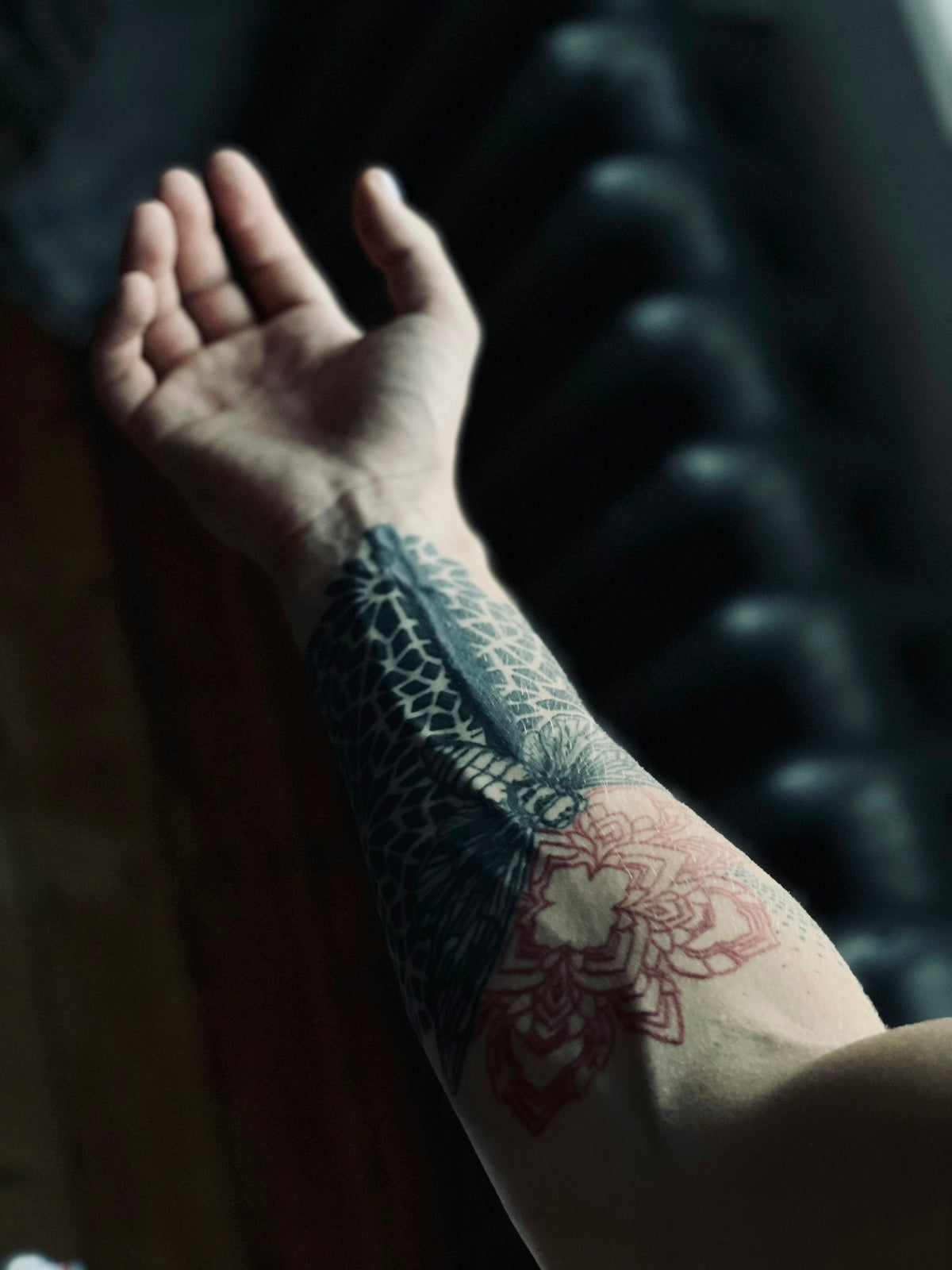 a hand with a tattoo on it