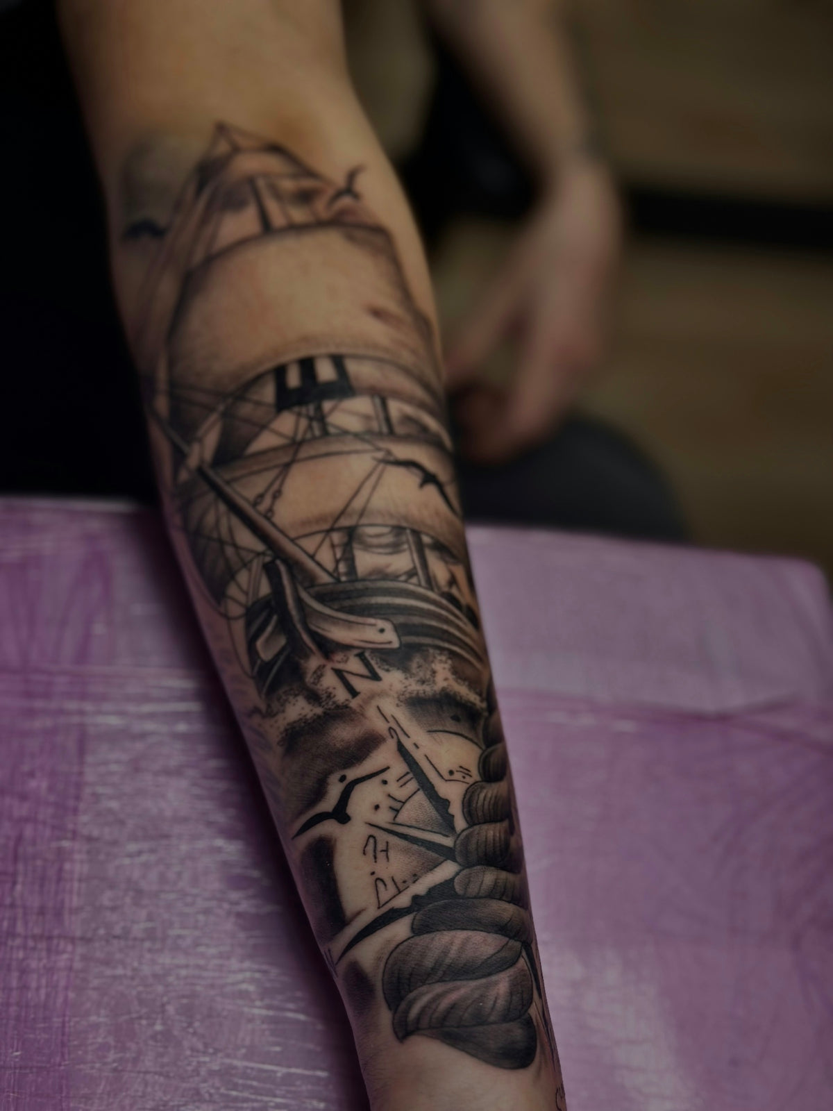 a person with a tattoo on their arm