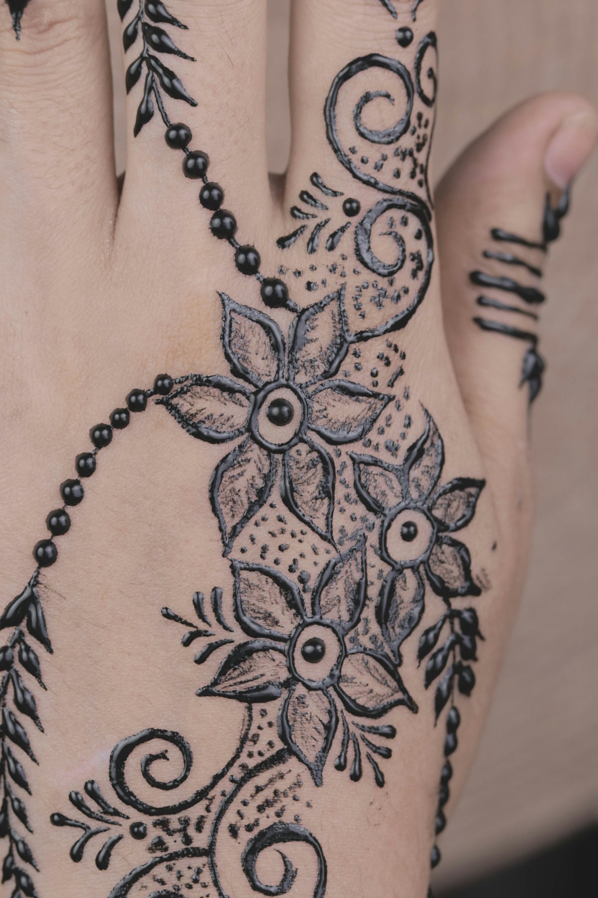 hand with blue tattoo