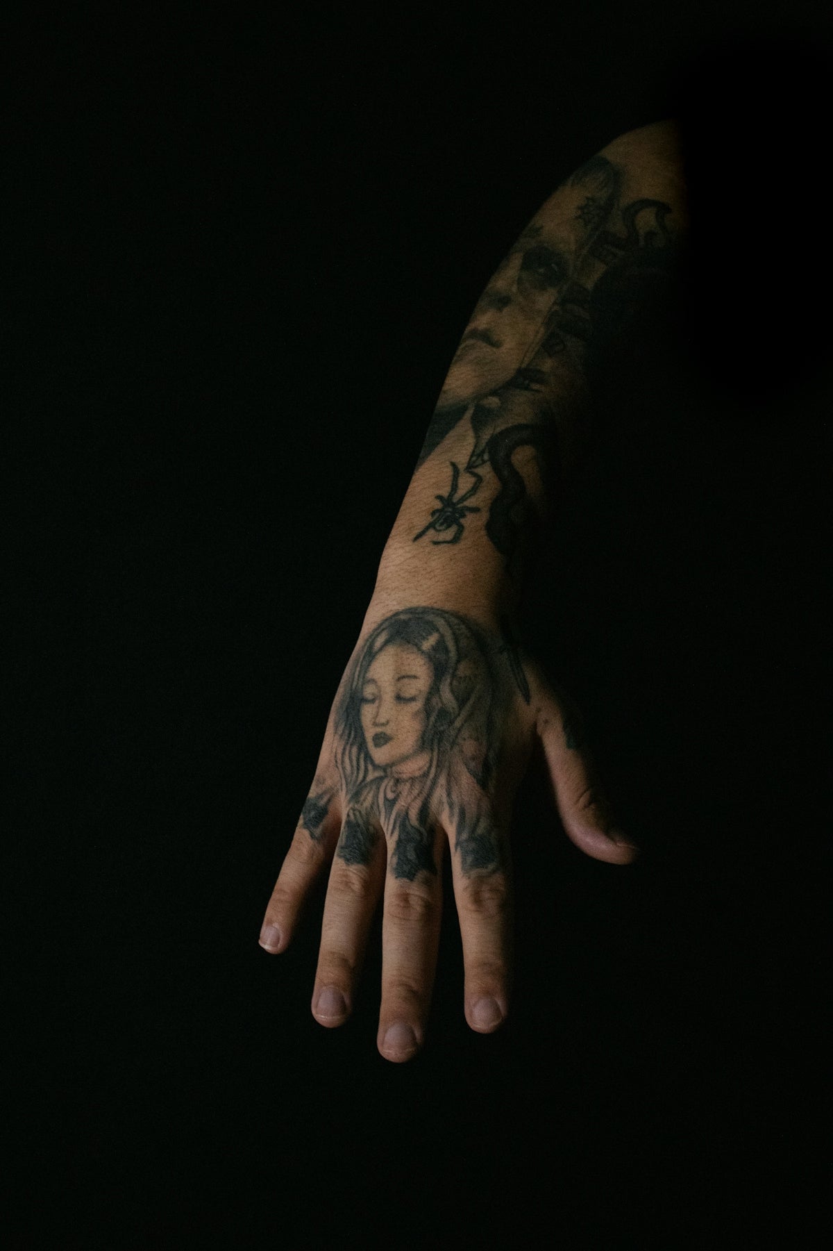 a person's hand with a tattoo on it