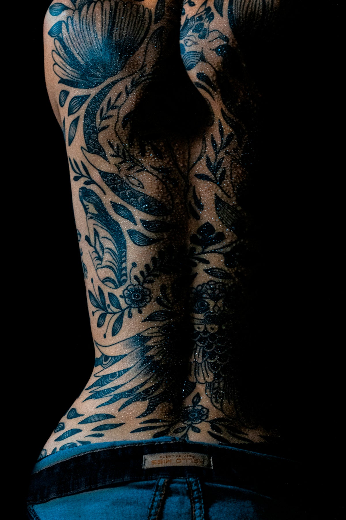 a person's leg with tattoos
