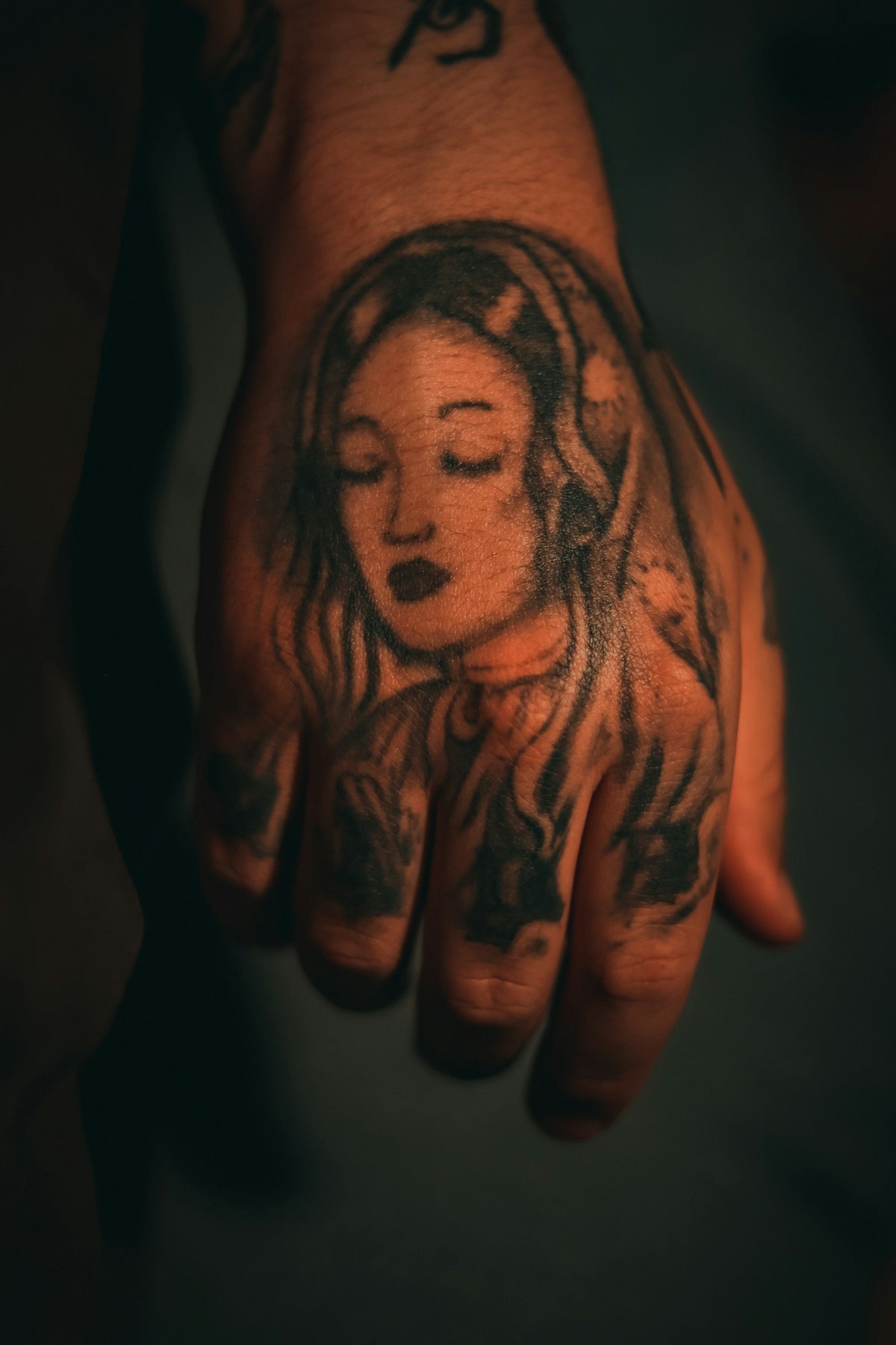 a person's arm with tattoos