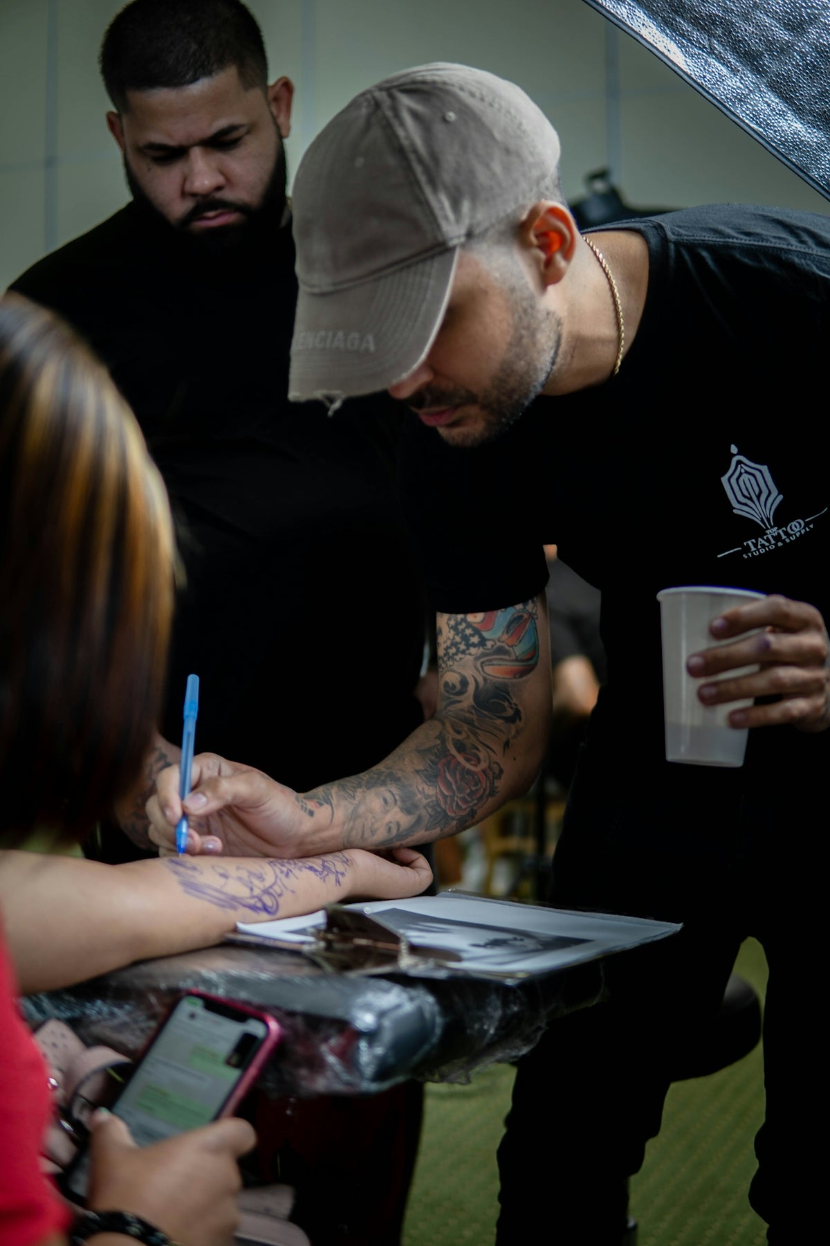 a man writing on a piece of paper