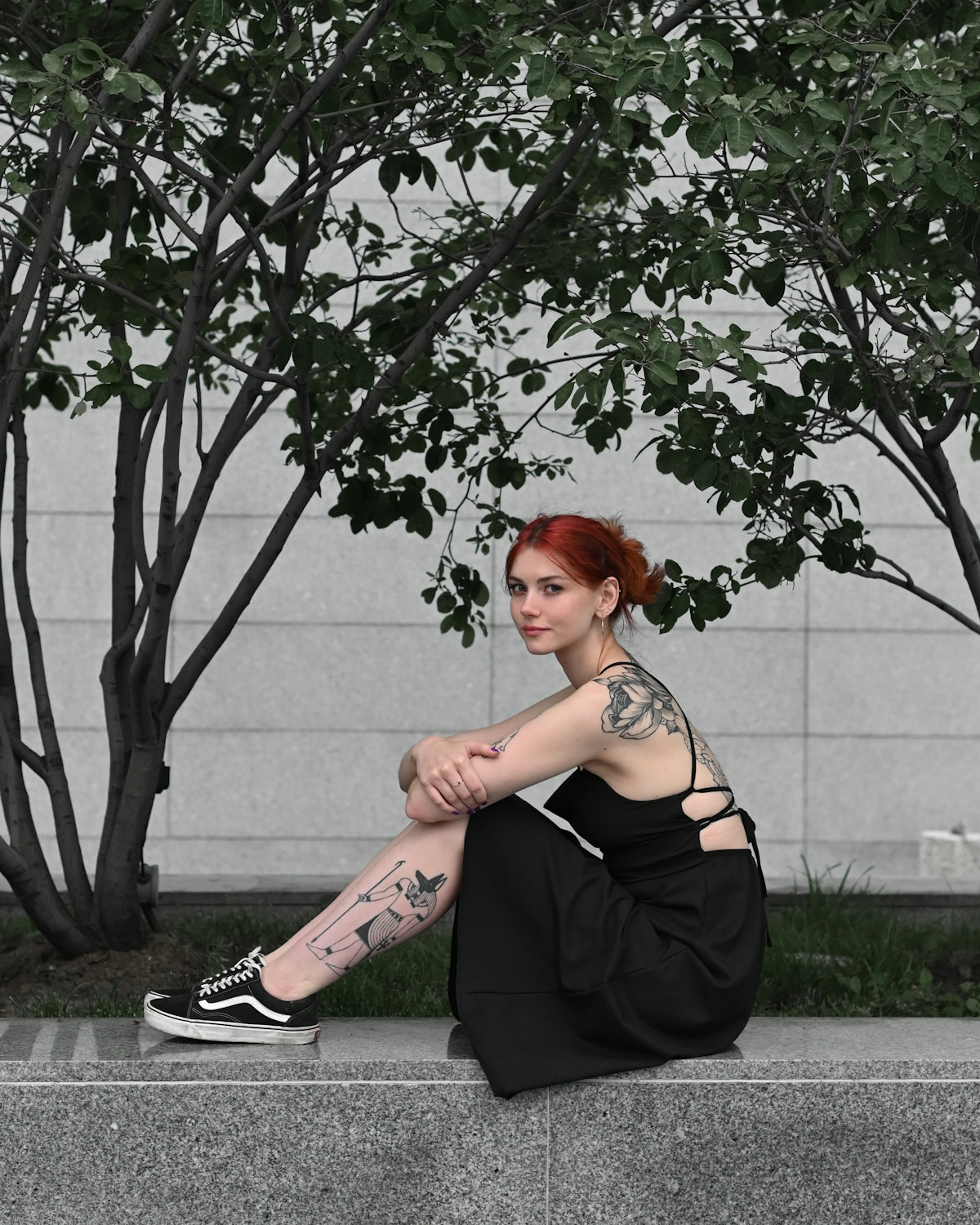 a person sitting on a curb