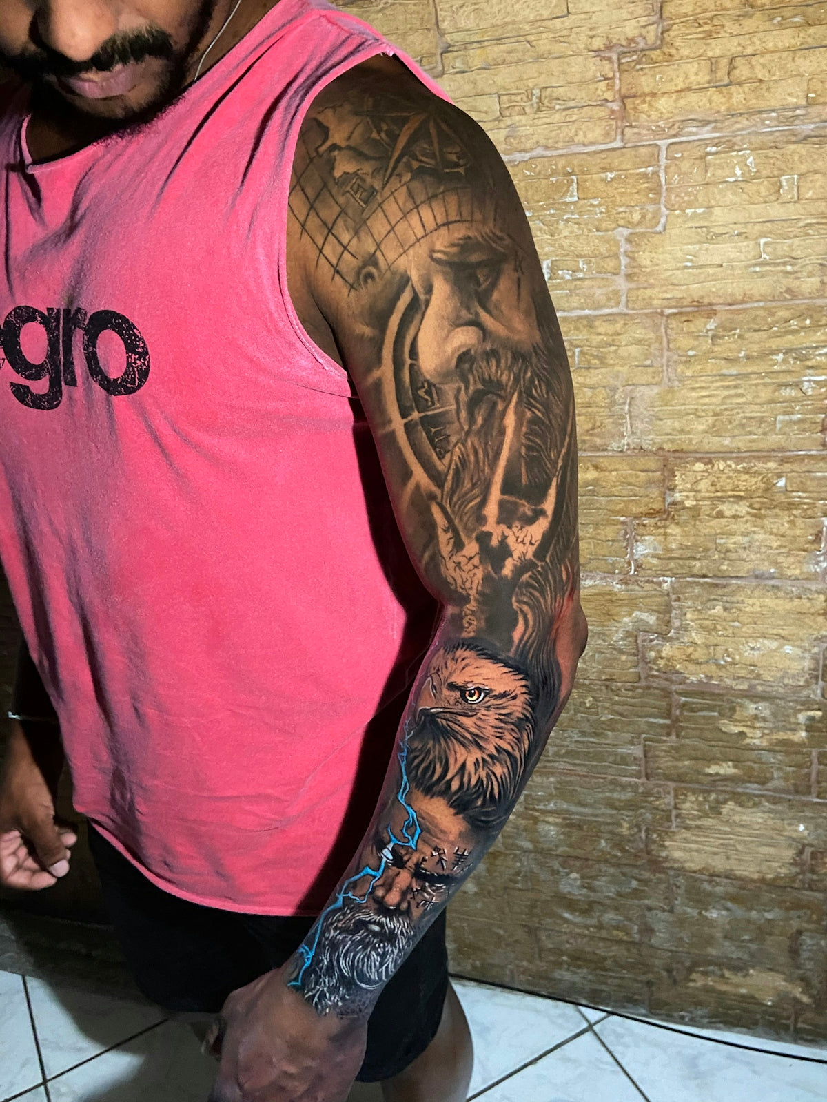 a man with a tattoo on his arm